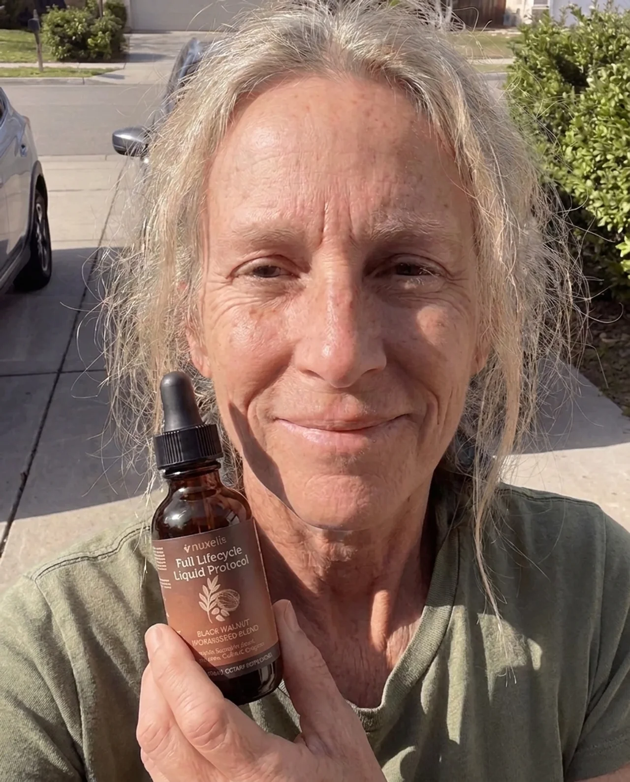 Sarah K. holding ParaCycle bottle outdoors